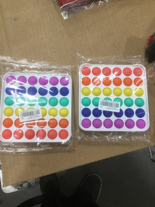 Photo 1 of VCOSTORE Push Pop Bubble Fidget Sensory Toy,Push Pop Fidget It Toy for Kids and Adults,New Fidget Popper Stress Reliever Toys for Autism ADHD Special Needs (Square-Rainbow 2 pack