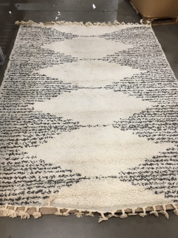 Photo 1 of 6'6"x9" area rug cream// item is stained 