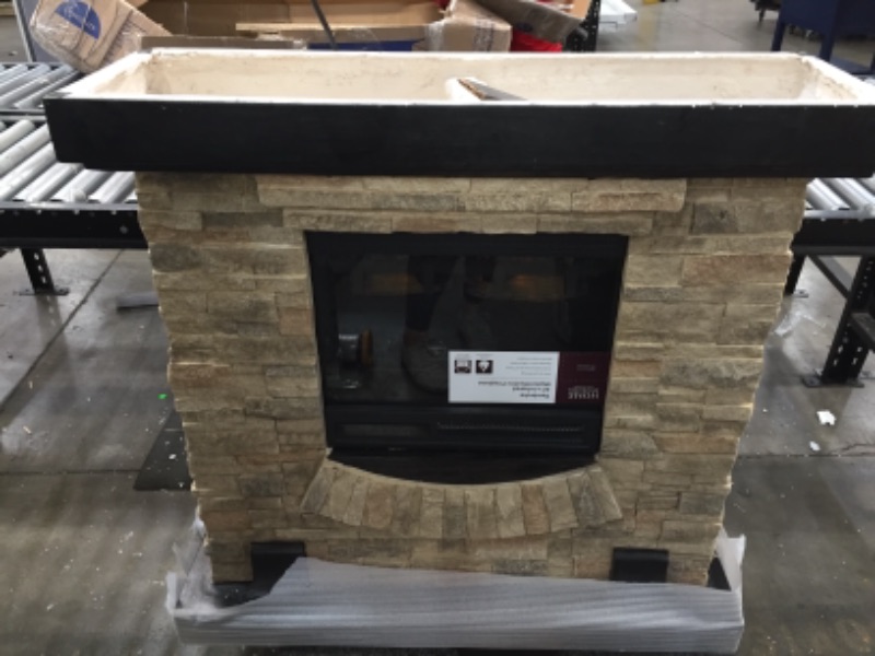 Photo 2 of **DAMAGED CORNER**
Home Decorators Collection
Pembroke 40 in. Freestanding Faux Stone Infrared Electric Fireplace in Tan with Mantel

//FIREPLACE POWERS ON!