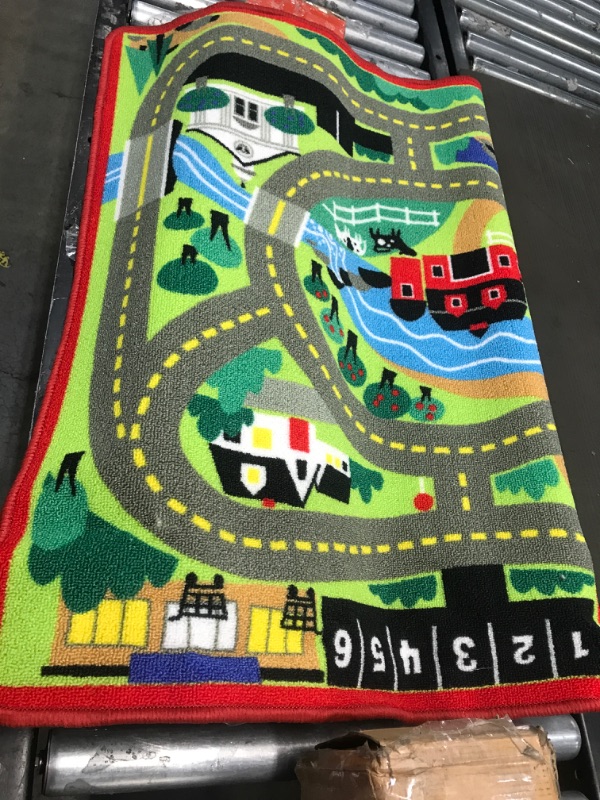 Photo 2 of Melissa & Doug Round the Town Road Rug & Car Set (Cars & Trucks, Safe for All Floors, 4 Wooden Cars, Frustration-Free Packaging)
