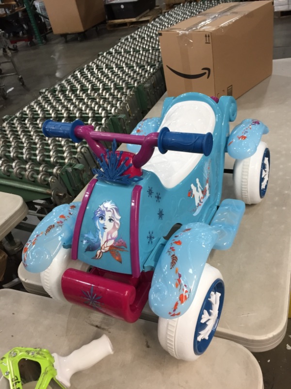 Photo 3 of Kid Trax Toddler Disney Frozen 2 Electric Quad Ride On Toy, Kids 1.5-3 Years Old, 6 Volt Battery and Charger Included, Max Weight 45 lbs, Frozen 2 Blue
**USED**