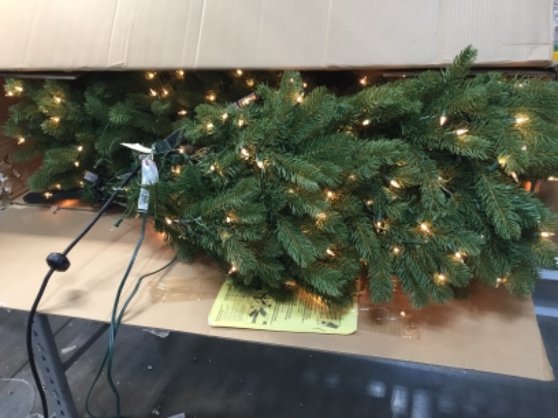 Photo 2 of **SOME LIGHTS ARE NON-FUNCTIONAL AS SHOWN** National Tree Company Pre-lit 'Feel Real' Artificial Slim Downswept Christmas Tree, Green, Douglas Fir, White Lights, Includes Stand, 9 feet
