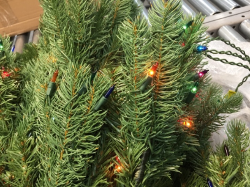 Photo 3 of **IN SOME SECTIONS LIGHTS DO NOT LIGHT UP** National Tree Company Pre-Lit 'Feel Real' Artificial Full Downswept Christmas Tree, Green, Douglas Fir, Multicolor Lights, Includes Stand, 4.5 feet
