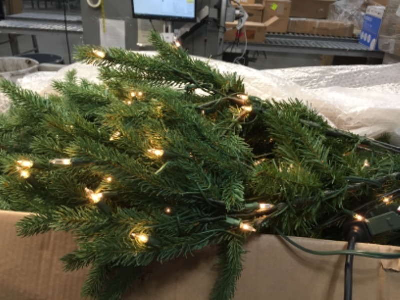 Photo 2 of **SOME LIGHTS ARE NOT FUNCTIONAL** National Tree Company 'Feel Real' Pre-lit Artificial Christmas Tree | Includes Pre-strung White Lights and Stand | Jersey Fraser Fir - 6.5 ft
