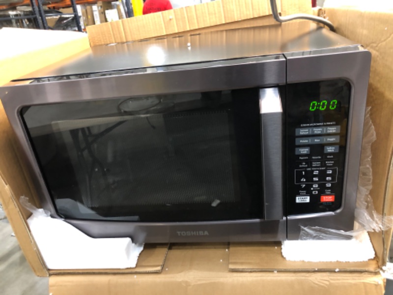 Photo 1 of TESTED WORKS**
Toshiba EM131A5C-BS Microwave Oven with Smart Sensor, Easy Clean Interior, ECO Mode and Sound On/Off, 1.2 Cu Ft, Black Stainless Steel
