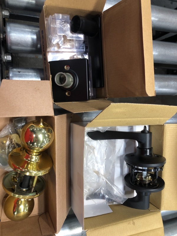 Photo 1 of **ASSORTED DOOR KNOBS** 
Defiant Zacoti Matte Black Bed/Bath Door Handle
and Kwikset Breton Square Matte Black Half -Dummy Door Lever
and Kwikset Polo Polished Brass Privacy Door Knob