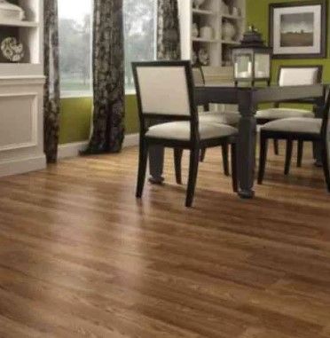 Photo 1 of (4-Pack) TrafficMaster - Oak 12 mm Thick x 8.03 in. Wide x 47.64 in. Length Laminate Flooring (15.94 sq. ft. / case)