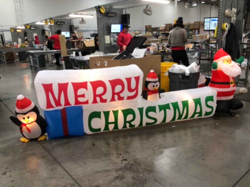 Photo 3 of Home Accents Holiday 11.5 ft Pre-Lit LED Giant-Sized Airblown Merry Christmas Sign with Santa and Penguin Scene Inflatable
