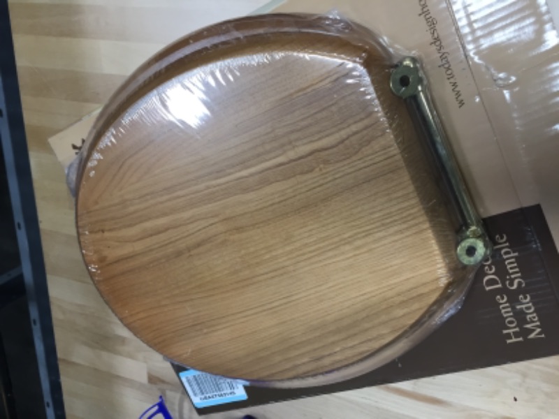 Photo 2 of **SEAT IS BROKEN**
Design House 561241 Dalton Round Toilet Seat, Concealed Screws, Honey Oak Finish, One Size
