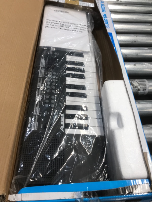 Photo 2 of Alesis Melody 32 – Electric Keyboard Digital Piano with 32 Keys, Speakers, 300 Sounds, 300 Rhythms, 40 Songs, USB-MIDI Connectivity and Piano Lessons
