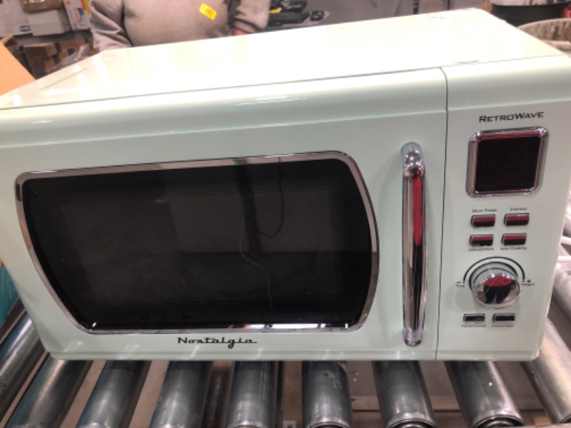 Photo 2 of ***DAMAGED***, ***IT DOESN'T POWER ON***, ***NEVER USED***
Nostalgia MCMO9FTSG Mid-Century Retro 0.9 Cu. Ft. 900-Watt Countertop Microwave Oven With LED Display, Seafoam Green