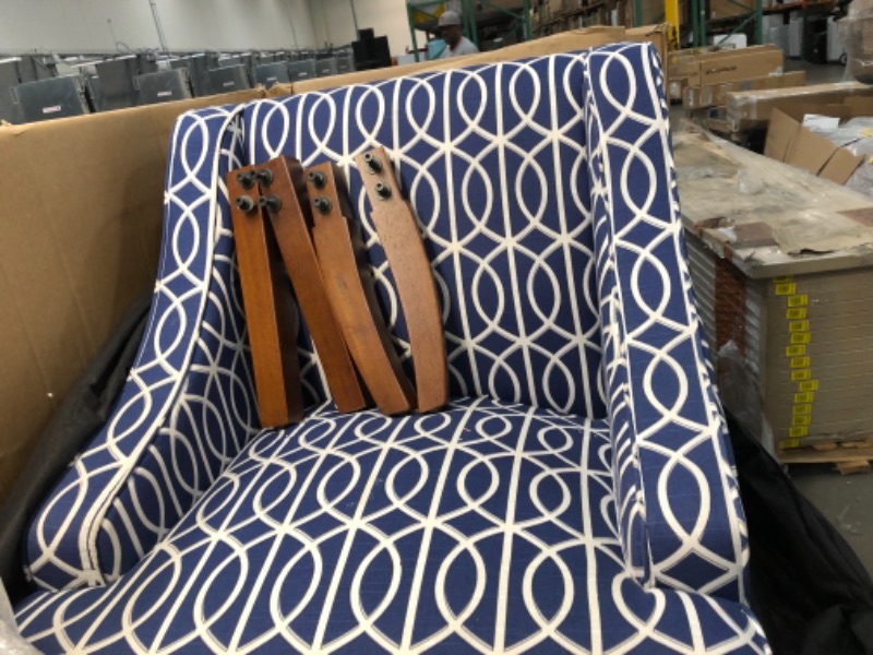 Photo 3 of **GENERAL POST**
BLUE UPHOLSTERED CHAIR WITH  GEOMETRIC SHAPED WHITE LINES AND WALNUT COLORED WOODEN LEGS