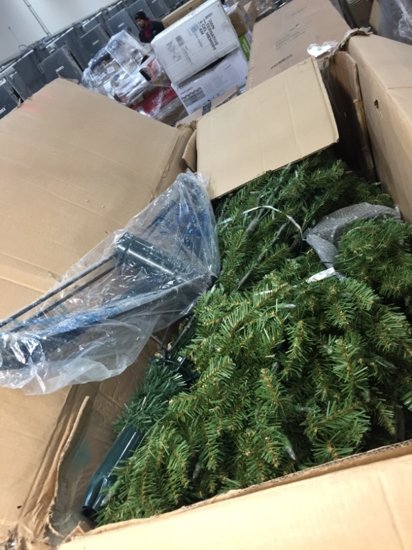 Photo 2 of **DOES NOT LIGHT UP**
National Tree Company Artificial Pre-Lit Slim Christmas Tree, Green, Kingswood Fir, White Lights, Includes Stand, 9 Feet
