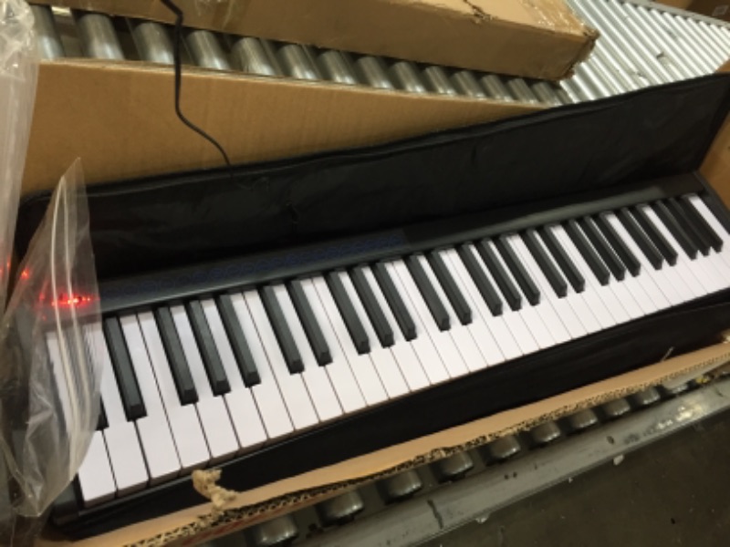 Photo 2 of **SOME KEYS DO NOT WORK**
Costway 61 Keys Portable Digital Piano w/ Power Supply Sustain Pedal & Black
