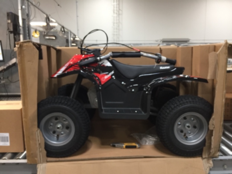 Photo 4 of Razor Dirt Quad - 24V Electric 4-Wheeler ATV - Twist-Grip Variable-Speed Acceleration Control, Hand-Operated Disc Brake, 12" Knobby Air-Filled Tires
