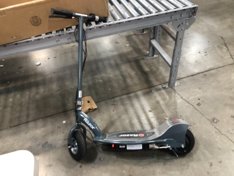 Photo 3 of (CRACKED TAILGATE)
Razor E300 Electric Scooter - 9" Air-filled Tires, Up to 15 mph and 10 Mile Range