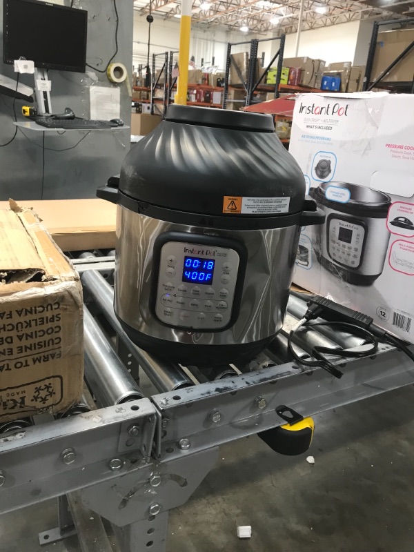 Photo 2 of **POT HAS MINOR DENTS, **
Instant Pot Duo Crisp 11-in-1 Electric Pressure Cooker with Air Fryer Lid, 8 Quart Stainless Steel/Black, Air Fry, Roast, Bake, Dehydrate, Slow Cook, Rice Cooker, Steamer, Sauté
