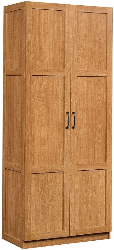 Photo 1 of **MISSING HARDWARE**
Sauder Storage Cabinet, Highland Oak Finish
