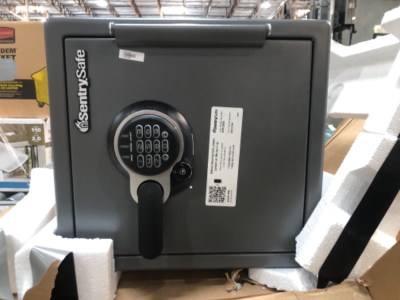 Photo 2 of ***PARTS ONLY**SAFE HAS PAMPHLET WITH ACCESS CODE BUT SAFE DOES NOT OPEN**
SentrySafe SFW123GDC Fireproof Waterproof Safe with Digital Keypad, 1.23 Cubic Feet, Gun Metal Gray
