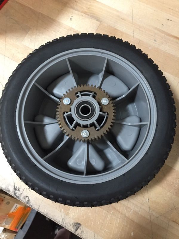 Photo 2 of 125-2509 Toro 10 inch wheel with gear assembly
