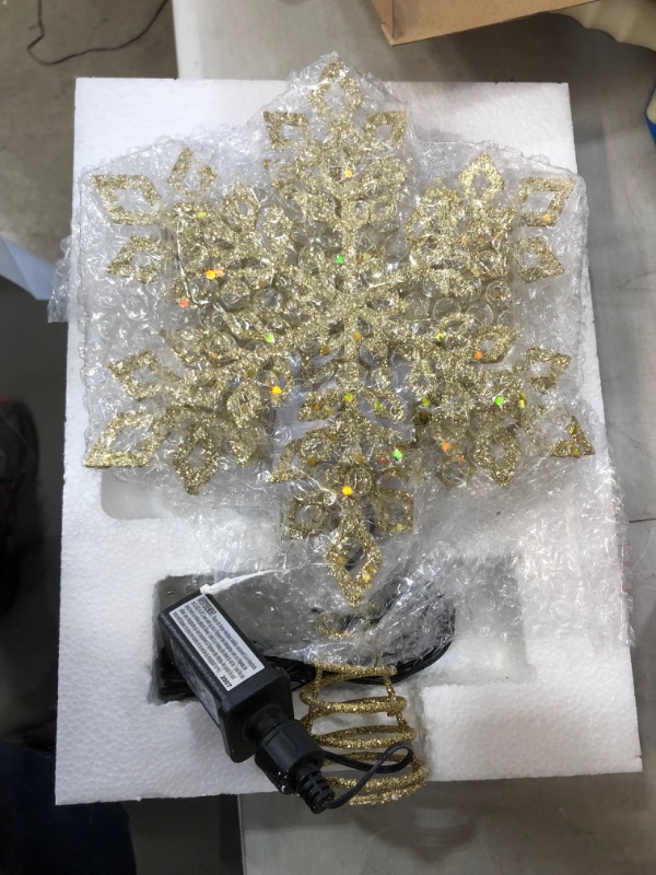 Photo 2 of  3D Snowflake Christmas Tree Topper Lighted Tree Toppers with LED Rotating Projector Lights, GOLD Snowflake Tree Topper for Christmas Tree Decorations
