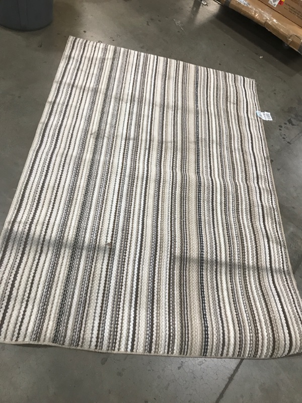 Photo 1 of **GENERAL POST**
5'X 7' Brown, white and tan area rug