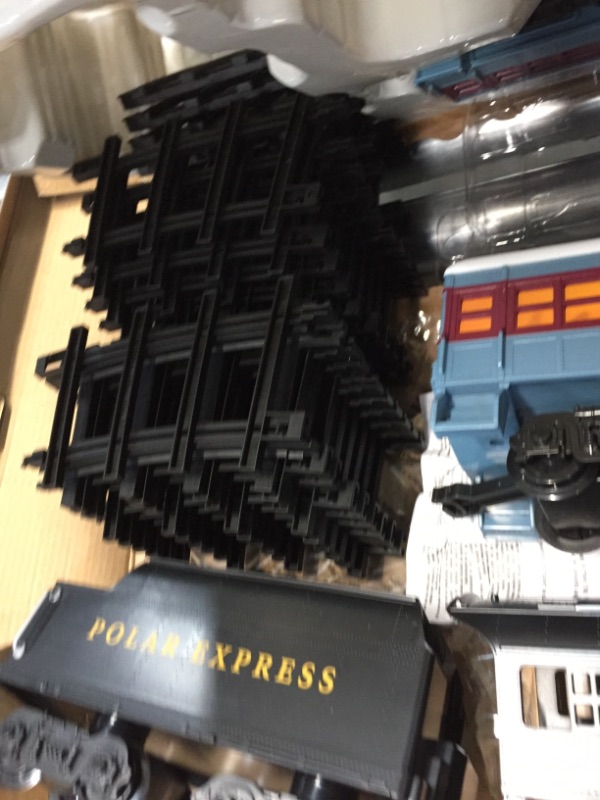 Photo 3 of Lionel The Polar Express battery-powered Train Set with Remote + 12-Piece Straight Track Expansion Pack
