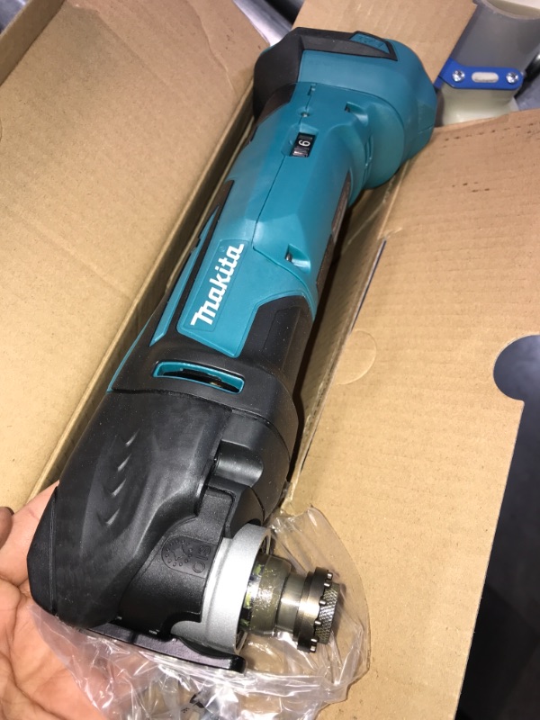 Photo 1 of Makita 18-Volt LXT Lithium-Ion Cordless Variable Speed Oscillating Multi-Tool (Tool-Only) With Blade and Accessory Adapters