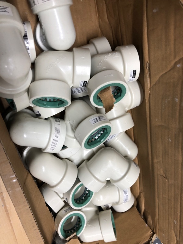 Photo 1 of 1 in. PVC-Lock 90-Degree Elbow ( Box Unknow Amount) 
