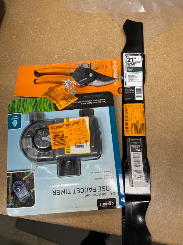 Photo 1 of *Non- Refundable* Home Depot Assortment of Miscellaneous Items, scissors, hose timer, mulching blade 
