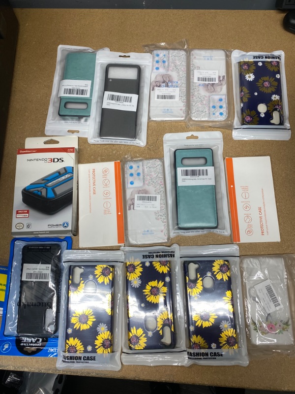 Photo 1 of *Non- Refundable* Assortment of Miscellaneous Samsung Galaxy Items with Nintendo 3DS Expedition Case 15 pack 