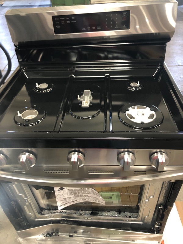 Photo 2 of ***DAMAGED** Samsung
6.0 cu. ft. Smart Freestanding Gas Range with 18K BTU Dual Power Burner in Black Stainless Steel