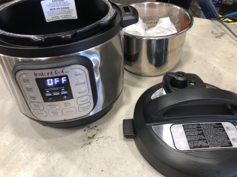 Photo 2 of **MINOR DENTS** Instant Pot Duo Mini 3 Qt 7-in-1 Multi- Use Programmable Pressure Cooker, Slow Cooker, Rice Cooker, Steamer, Sauté, Yogurt Maker and Warmer