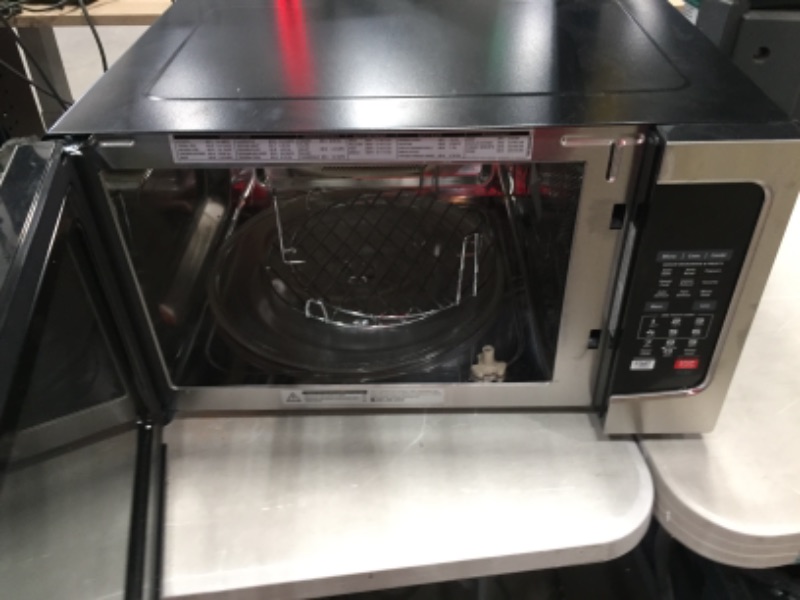 Photo 2 of PARTS ONLY NON REFUNDABLE 
Toshiba EC042A5C-SS Countertop Microwave Oven with Convection, Smart Sensor, Sound On/Off Function and LCD Display, 1.5 Cu.ft, Stainless Steel