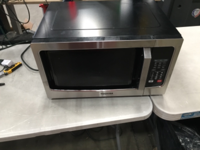 Photo 3 of PARTS ONLY NON REFUNDABLE 
Toshiba EC042A5C-SS Countertop Microwave Oven with Convection, Smart Sensor, Sound On/Off Function and LCD Display, 1.5 Cu.ft, Stainless Steel