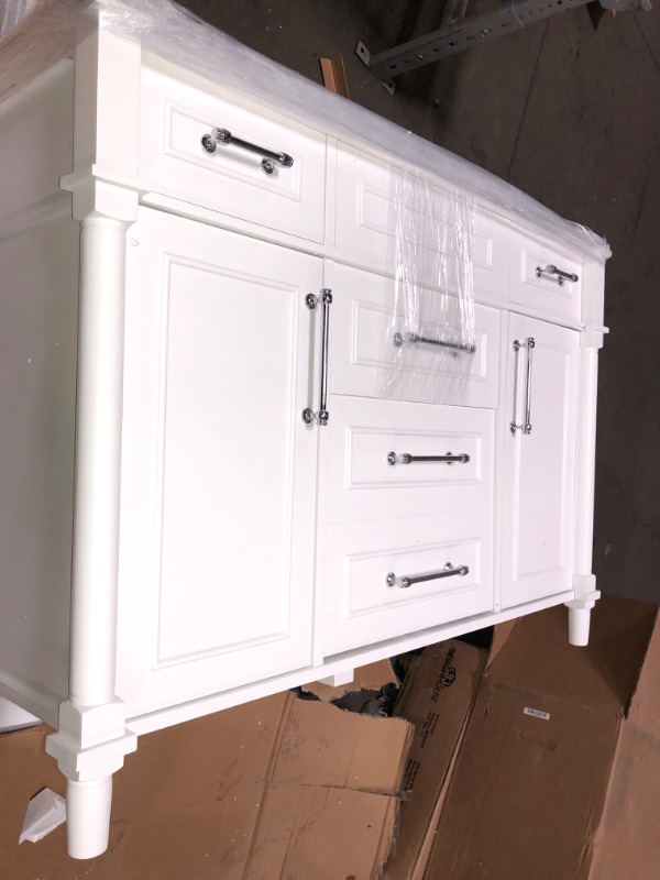 Photo 12 of *Damage shown in picture*
Home Decorators Collection Aberdeen 48 in. W X 22 in. D Vanity in White with Carrara Marble Top with White Sink
