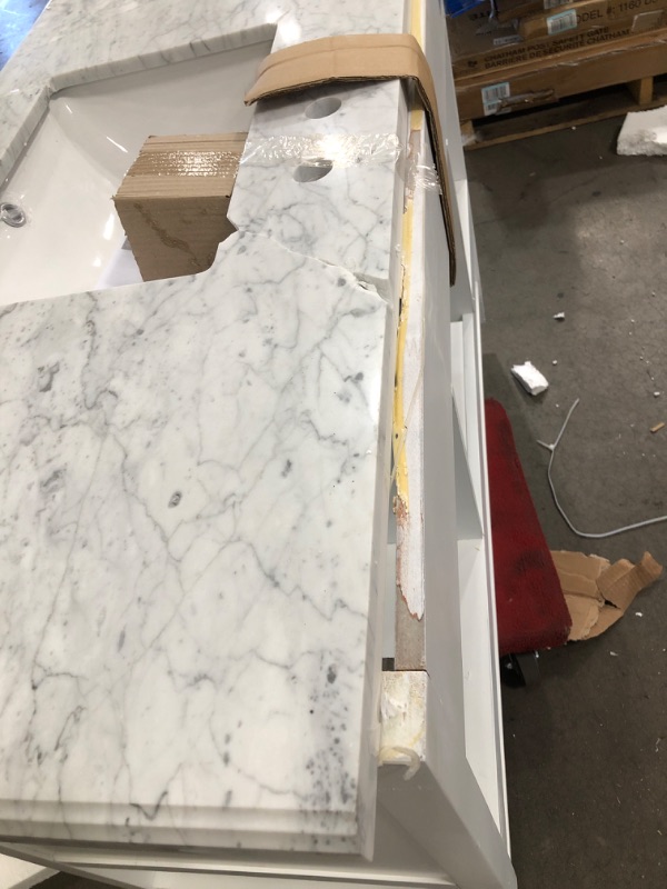 Photo 1 of ***DAMAGE SHOWN IN PICTURE***  Home Decorators Collection Everett 49 in. W X 22 in. D Vanity Cabinet in White with Carrara Marble Vanity Top in White with White Basin
