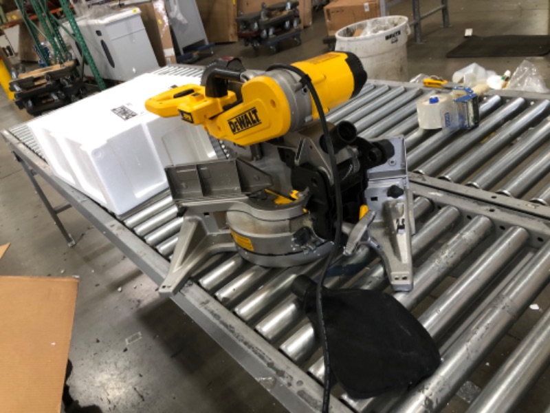 Photo 2 of (Circuit blown when powered on and motor smoked) 
DEWALT Miter Saw, 12-Inch, Double Bevel, Compound, XPS Cutline, 15-Amp with w/Safety Goggle (DWS716XPS & DPG82-11C)