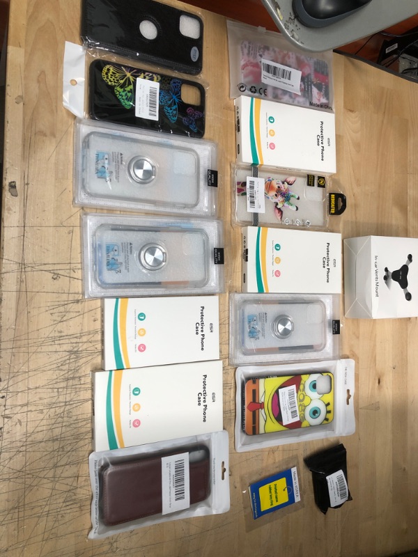 Photo 1 of **NON REFUNDABLE**
BUNDLE OF IPHONE 11 CASES , AIR POD CASE , IN CAR VENT MOUNT AND ACCESSORIES.