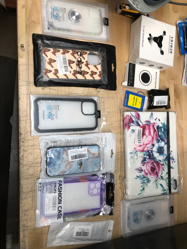 Photo 1 of ** NON REFUNDABLE**
BUNDLE OF IPHONE 12 CASES , APPLE WATCH BAND, IPAD CASE AND ACCESSORIES
