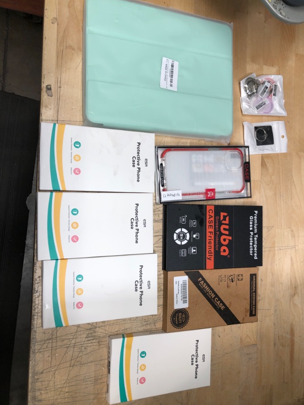 Photo 1 of **NON REFUNDABLE**
BUNDLE OF ASSORTED  IPHONE CASES , IPAD CASE , AND ACCESSORIES.
