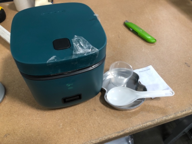 Photo 1 of *NOT exact stock picture, use for reference* 
1.2L Rice Cooker with Steamer Non- Stick cooking, High-Temperature Protection, One Touch Operation Perfect for One or Two People to Cook Rice, Meat, Noodles or Soup, TEAL
