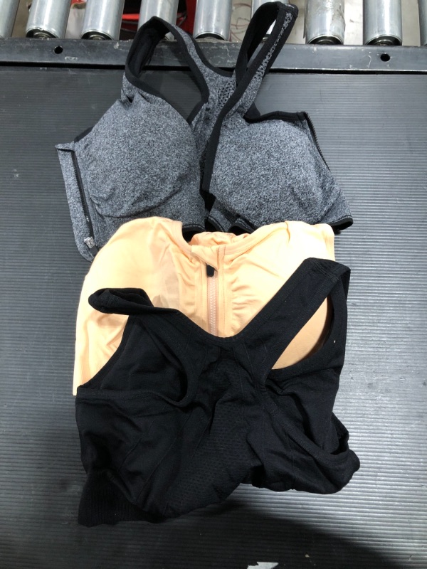 Photo 1 of 3 pairs of womens sport bras - size  L 