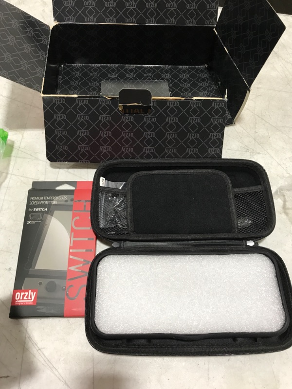 Photo 1 of Orzly Carry Case Compatible with Nintendo Switch and New Switch OLED Console - Black Protective Hard Portable Travel Carry Case Shell Pouch with Pockets for Accessories and Games
