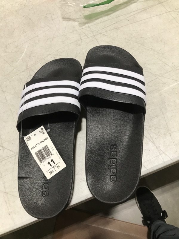 Photo 1 of adidas Men's Adilette Shower Slide Sandals from Finish Line 11