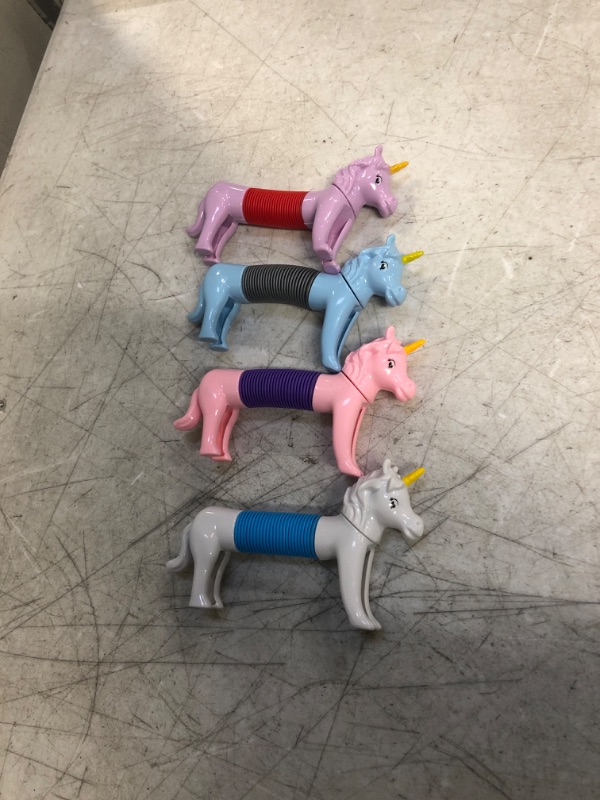 Photo 2 of Eavotoy 4 Pack Unicorn Pop Tube Sensory Stretch Toys Stress Relief Toys for Kids Boys Girls Christmas Stocking Stuffers Party Favors Gifts