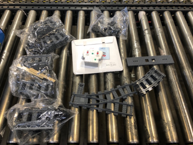 Photo 3 of LEGO City 60198  Cargo Train Remote Control Train Building Set with Tracks (1226 Pieces) - BOX IS MAJORLY DAMAGED - OPEN BOX - APPEARS TO BE MISSING 1 Track Plastic (RC Train) Curved - MISSING A FEW OTHER PIECES AS WELL