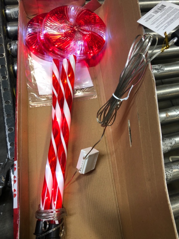 Photo 2 of Alpine Corporation 28" H Outdoor Candy Cane Yard Stakes with Red and White LED Lights (Set of 3)