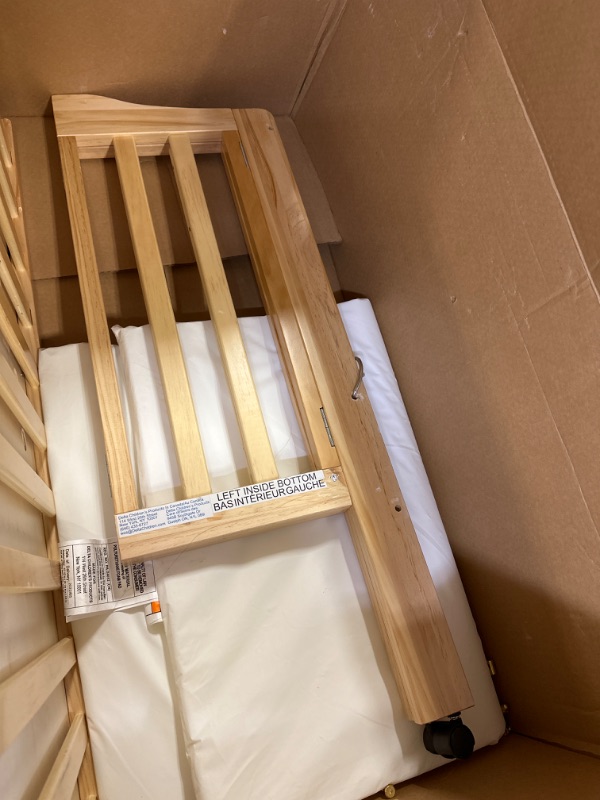 Photo 3 of Delta Children Folding Portable Mini Baby Crib with 1.5-inch Mattress - Greenguard Gold Certified, Natural------possibility of missing screws due to screws being loose inside box 