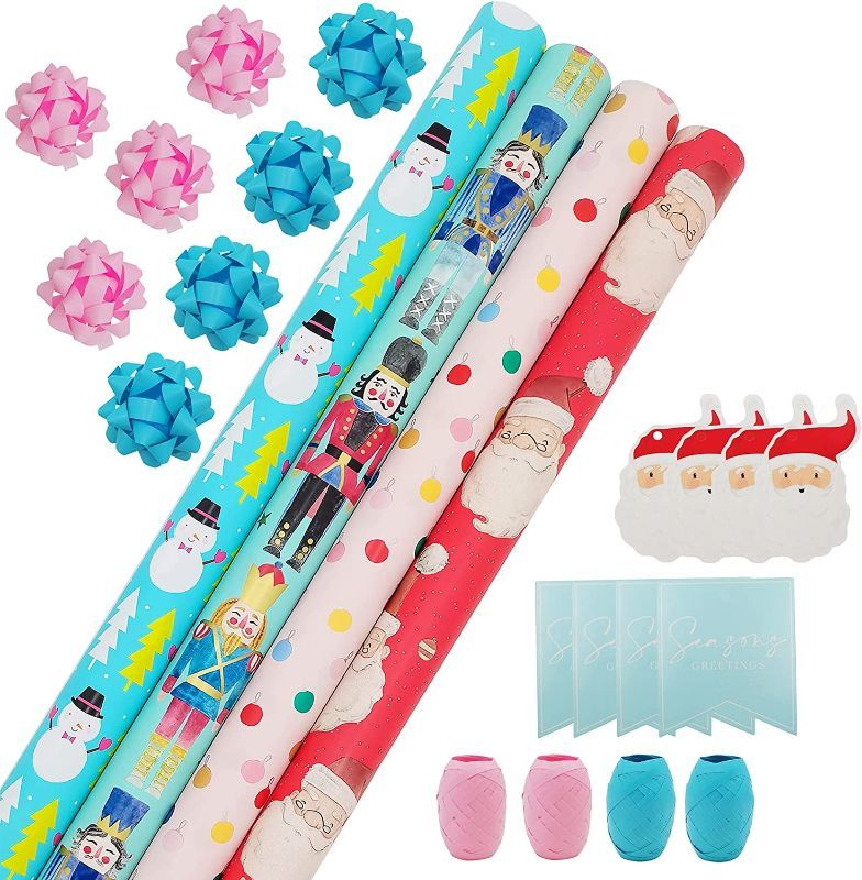 Photo 1 of Wrapping Paper, Christmas Wrapping Paper for Kids Boys, Girls, baby. 4 Cute Designs Including Santa, Christmas Lights, Snowman, Nutcracker. Includes Decorative Flowers, Ribbons, Labels. Each Roll of Gift Wrap Paper Measures 27.5 In X 13 ft
